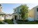 Charming two-story home featuring a well-maintained lawn and inviting front porch with beautiful landscaping at 10038 Verse Aly, Winter Garden, FL 34787