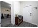 Bright entryway with wood-look floors, decorated console table, and a door to the office space at 10038 Verse Aly, Winter Garden, FL 34787