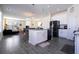 The kitchen features white cabinets, stainless steel appliances, and a breakfast bar at 10038 Verse Aly, Winter Garden, FL 34787
