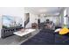 Open-concept living room features a sectional sofa, modern decor, and a view of the dining area and kitchen at 10038 Verse Aly, Winter Garden, FL 34787