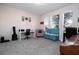 Cozy office featuring a modern desk, comfortable seating, and ample natural light through the windows at 10038 Verse Aly, Winter Garden, FL 34787