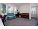 Bright home office space with large windows, bench seating, and an antique piano at 10038 Verse Aly, Winter Garden, FL 34787