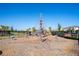 A vibrant community playground features a large web climber, offering a fun and engaging space for children at 10038 Verse Aly, Winter Garden, FL 34787