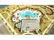 Overhead view showcases an amazing pool, community clubhouse, lounge chairs, and a fun playground nearby at 10038 Verse Aly, Winter Garden, FL 34787