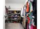 Spacious walk-in closet featuring ample storage shelves and hanging racks for organized clothing and accessories at 10038 Verse Aly, Winter Garden, FL 34787