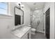 Elegant bathroom with marble countertop, glass-enclosed shower and modern fixtures at 11019 Kentmere Ct, Windermere, FL 34786
