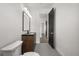 Bathroom featuring a modern vanity and an open doorway at 11019 Kentmere Ct, Windermere, FL 34786