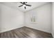 Cozy bedroom with hardwood floors, a single window, and white walls at 11019 Kentmere Ct, Windermere, FL 34786