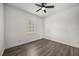 Neutral bedroom with a single window and a ceiling fan at 11019 Kentmere Ct, Windermere, FL 34786