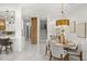 Bright dining space featuring a contemporary chandelier and open floor plan at 11019 Kentmere Ct, Windermere, FL 34786