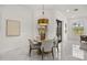 Cozy dining nook with a round table, modern chandelier, and stylish accents at 11019 Kentmere Ct, Windermere, FL 34786