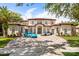 Elegant two-story home features a red tile roof and a large brick driveway at 11019 Kentmere Ct, Windermere, FL 34786