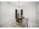 Bright home office with black doors, modern light fixture, and marble floors at 11019 Kentmere Ct, Windermere, FL 34786