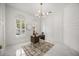 Bright home office with natural light, modern light fixture, and marble floors at 11019 Kentmere Ct, Windermere, FL 34786