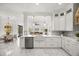 Bright kitchen with marble floors, stainless appliances, an island sink, and an open concept at 11019 Kentmere Ct, Windermere, FL 34786