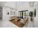 Bright living room with high ceilings, marble floors, and sliding glass doors to the outdoor pool area at 11019 Kentmere Ct, Windermere, FL 34786