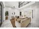 Bright living room with soaring ceilings, marble floors, and stylish modern decor at 11019 Kentmere Ct, Windermere, FL 34786