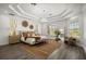 Inviting main bedroom featuring a tray ceiling, chandelier, and ample natural light at 11019 Kentmere Ct, Windermere, FL 34786