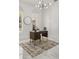 Bright office with marble floors, decorative trim, windows, and a stylish light fixture at 11019 Kentmere Ct, Windermere, FL 34786