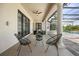 Relaxing covered patio featuring comfortable seating and views of the pool at 11019 Kentmere Ct, Windermere, FL 34786
