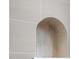 A neutral shower niche stands out against the textured gray tile at 11019 Kentmere Ct, Windermere, FL 34786
