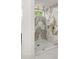 Modern bathroom features a glass shower with marble-look tile and a window for natural light at 11019 Kentmere Ct, Windermere, FL 34786