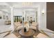 Open-concept living area with marble flooring, modern decor, and abundant natural light at 11019 Kentmere Ct, Windermere, FL 34786