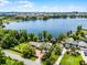 Aerial view of property showcasing lakefront location and mature landscaping at 11632 Lake Willis Dr, Orlando, FL 32821