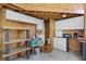 Barn interior with white cabinets, sink, and appliances, providing a functional space at 11632 Lake Willis Dr, Orlando, FL 32821
