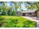 Attractive one-story home with brick accents, green lawn, and mature trees at 11632 Lake Willis Dr, Orlando, FL 32821