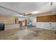 Spacious garage with utility sink, countertop, and ample storage space for various needs at 11632 Lake Willis Dr, Orlando, FL 32821