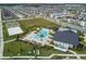 Aerial view of a community pool, clubhouse, basketball court, and volleyball court at 12127 Sonnet Ave, Orlando, FL 32832
