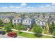 Aerial view of two-story homes with well-maintained lawns, landscaping, and mature trees at 12127 Sonnet Ave, Orlando, FL 32832