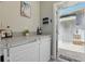 Stylish bar area with a quartz countertop, wine storage, and access to the outdoor space at 12127 Sonnet Ave, Orlando, FL 32832