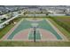 Aerial view of a community basketball court with benches on the sidelines at 12127 Sonnet Ave, Orlando, FL 32832