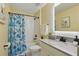 Cozy bathroom with a tub, colorful curtain, and modern fixtures at 12127 Sonnet Ave, Orlando, FL 32832
