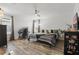 Serene bedroom featuring hardwood floors, a ceiling fan, and a comfortable bed at 12127 Sonnet Ave, Orlando, FL 32832