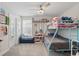 Fun bedroom featuring a bunk bed, playful decor, and a cozy space for relaxation and play at 12127 Sonnet Ave, Orlando, FL 32832