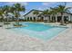 A community pool features fountain elements, is surrounded by lounge chairs, and lush landscaping at 12127 Sonnet Ave, Orlando, FL 32832