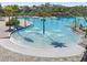 A community pool featuring a splashpad and multiple entry points for easy access and Gathering fun at 12127 Sonnet Ave, Orlando, FL 32832