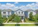 Charming two-story home with well-maintained lawn, lush landscaping, and mature trees at 12127 Sonnet Ave, Orlando, FL 32832