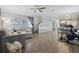 Open-concept living space with seating area, dining space, and a view towards the kitchen at 12127 Sonnet Ave, Orlando, FL 32832