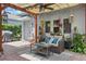 Inviting outdoor patio with a covered pergola, wicker seating and various plants for a cozy setting at 12127 Sonnet Ave, Orlando, FL 32832