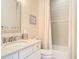 Bathroom featuring a vanity, toilet, and tiled tub with shower at 1271 Thoroughbred Trl, Sanford, FL 32771