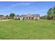 Lovely home with rustic shutters, a charming front porch, and expansive green lawn at 1271 Thoroughbred Trl, Sanford, FL 32771