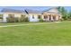 Home with shuttered windows, front porch with wooden columns, and a wide green lawn at 1271 Thoroughbred Trl, Sanford, FL 32771