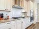 Well-equipped kitchen with stainless steel appliances, granite counters, and white subway tile backsplash at 1271 Thoroughbred Trl, Sanford, FL 32771