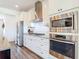Modern kitchen featuring stainless steel appliances, granite countertops, and ample cabinet space at 1271 Thoroughbred Trl, Sanford, FL 32771