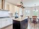 Beautiful kitchen with white cabinets, stainless appliances, and center island for prep and dining at 1271 Thoroughbred Trl, Sanford, FL 32771