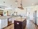 Well-designed kitchen features an island, stainless steel appliances and stylish cabinetry for cooking at 1271 Thoroughbred Trl, Sanford, FL 32771